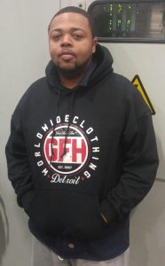 Man standing wearing black WorldWideClothing Detroit sweatshirt