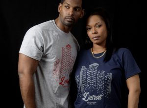 Man and woman standing next to eachother wearing t-shirts